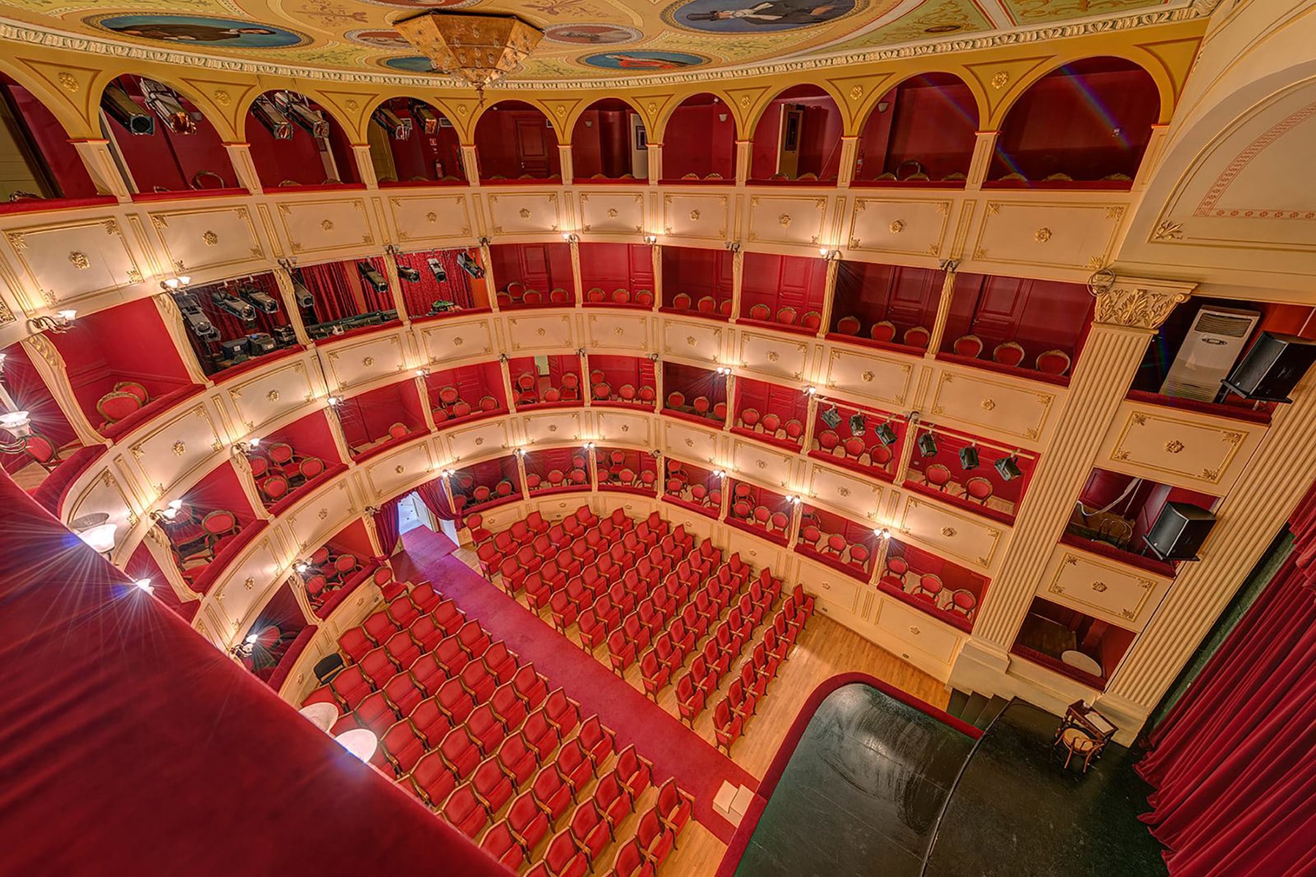 View of the auditorium and the main stage of the ‘Apollon Theatre’ in Syros from the upper balcony